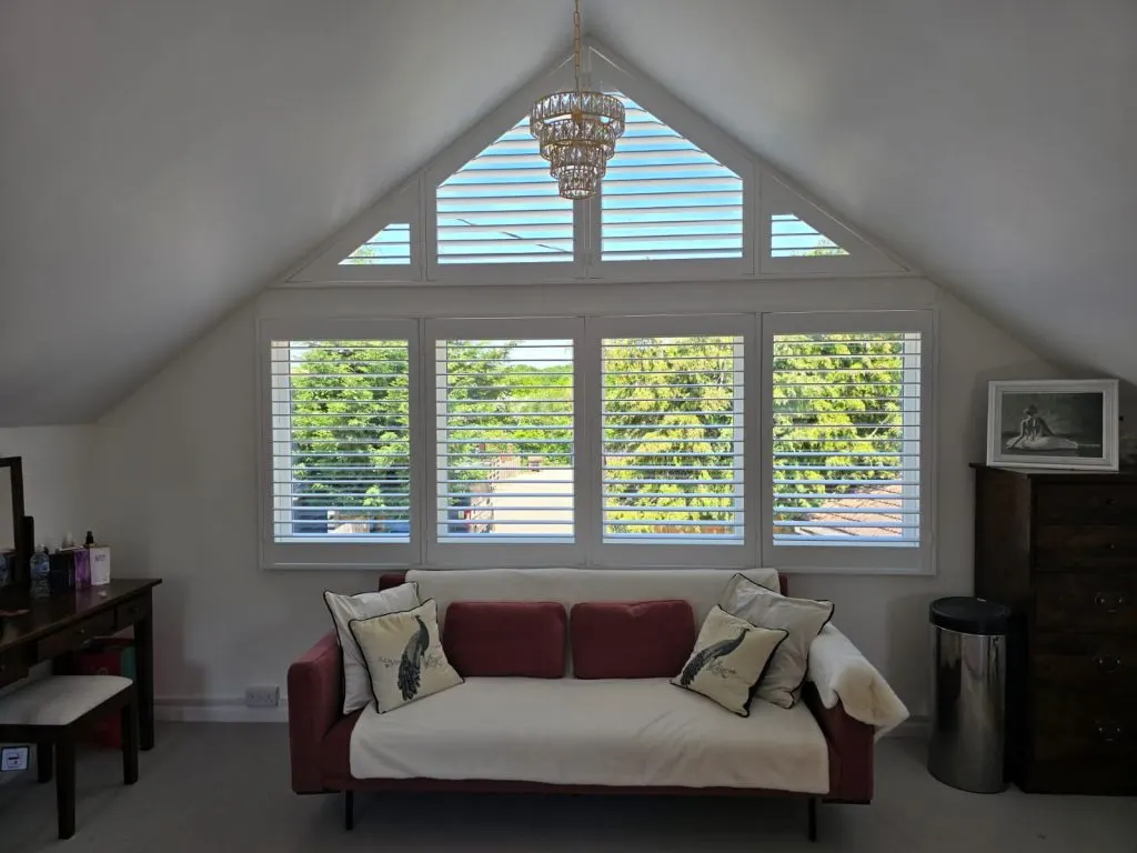 Custom shaped shutters fitted to an arched window